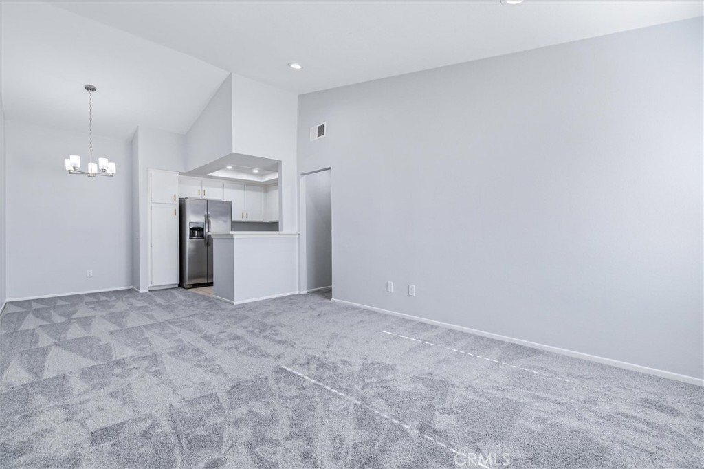 78 Costero Aisle, Unit 301 Irvine, CA 92614 - Photo 9 of 38 a view of empty room with a kitchen