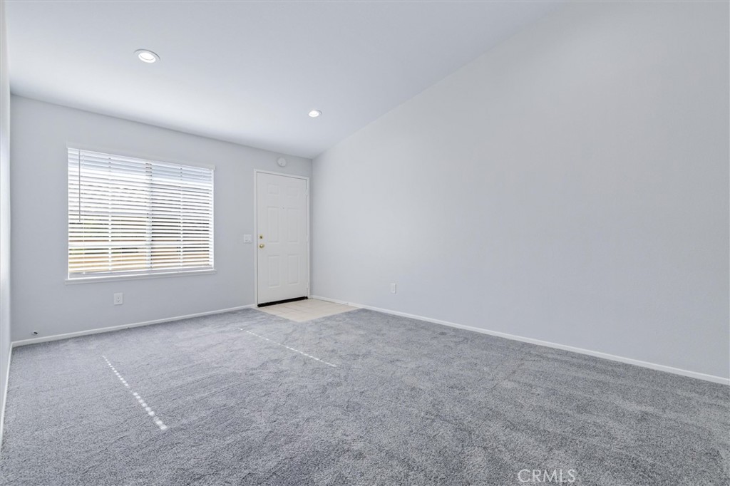 78 Costero Aisle, Unit 301 Irvine, CA 92614 - Photo 10 of 38 an empty room with windows