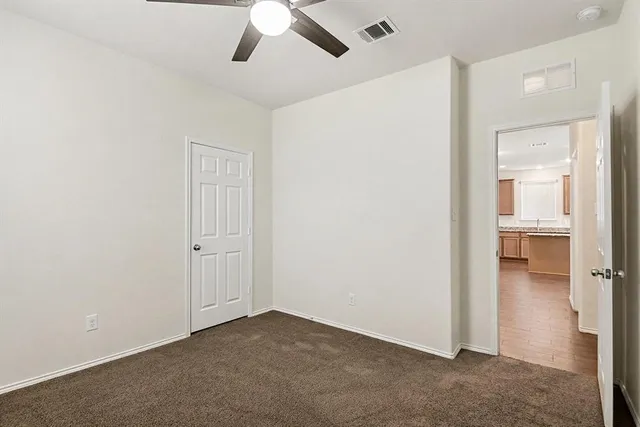 an empty room with a bathroom