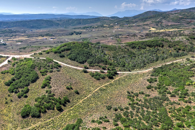 1646 North Miles Holw Road, Unit 29 Kamas, UT 84036 - Photo 6 of 35 Expansive acreage featuring natural vegetation, gently rolling hills, and a winding dirt road