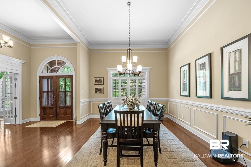 29976 Dolive Ridge Daphne, AL 36527 - Photo 14 of 58 Dining area with french doors, hardwood / wood-style floors, a chandelier, and ornamental molding