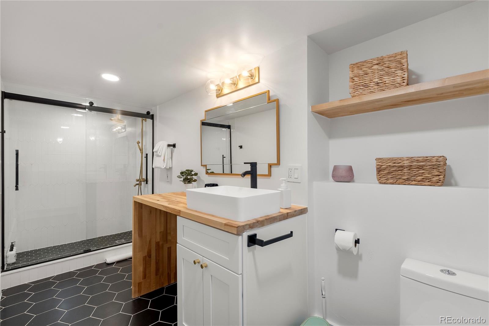 3009 Depew Street Wheat Ridge, CO 80214 - Photo 24 of 32 a bathroom with a sink toilet and shower