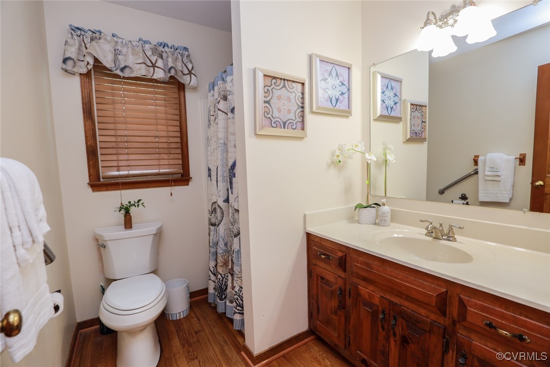 8510 Katy Reid Road Chesterfield, VA 23832 - Photo 27 of 50 a bathroom with a toilet sink and mirror