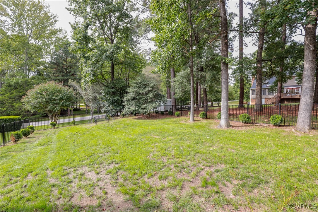 8510 Katy Reid Road Chesterfield, VA 23832 - Photo 48 of 50 a swimming pool with lots of tress in front of it