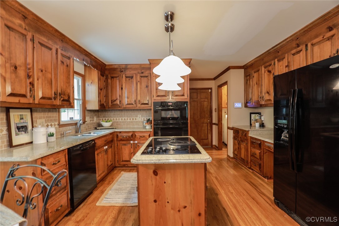 8510 Katy Reid Road Chesterfield, VA 23832 - Photo 10 of 50 a kitchen with granite countertop stainless steel appliances and wooden cabinets
