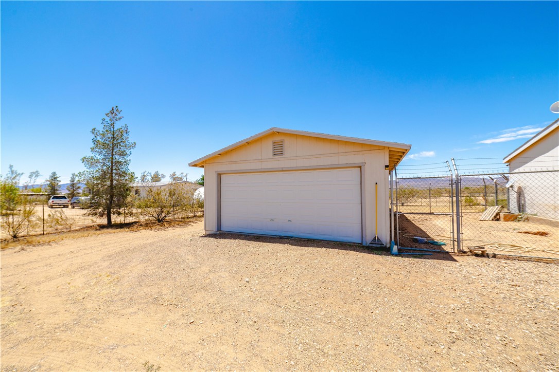 4729 Stewart Mountain Road Golden Valley, AZ 86413 - Photo 24 of 28 a view of a house with a outdoor space