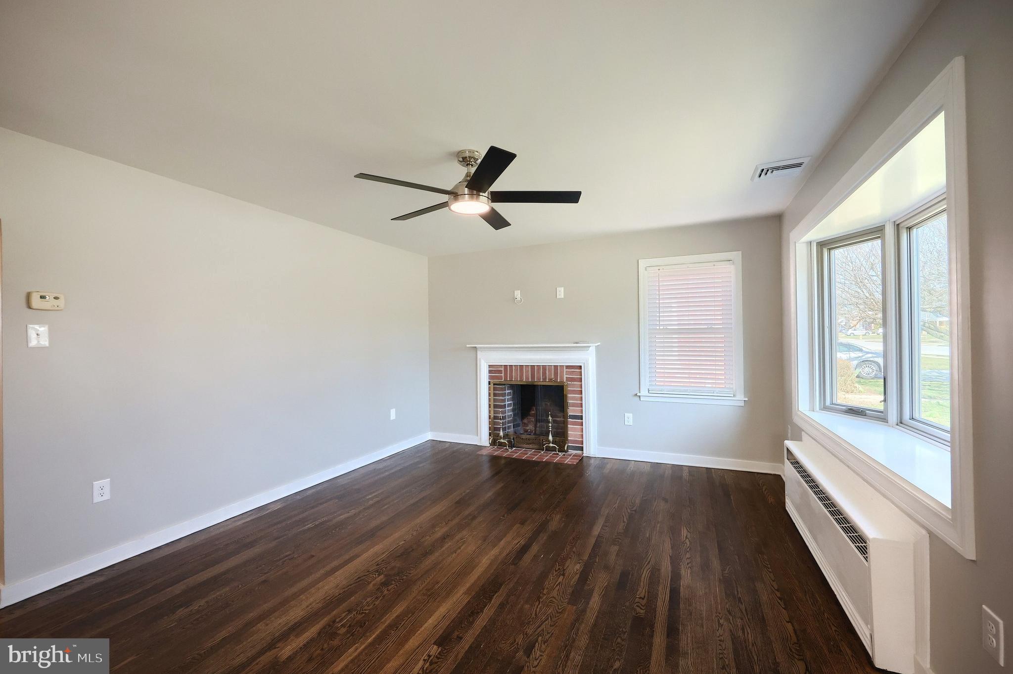 106 North Williams Street York, PA 17404 - Photo 15 of 42 wooden floor in an empty room with a window
