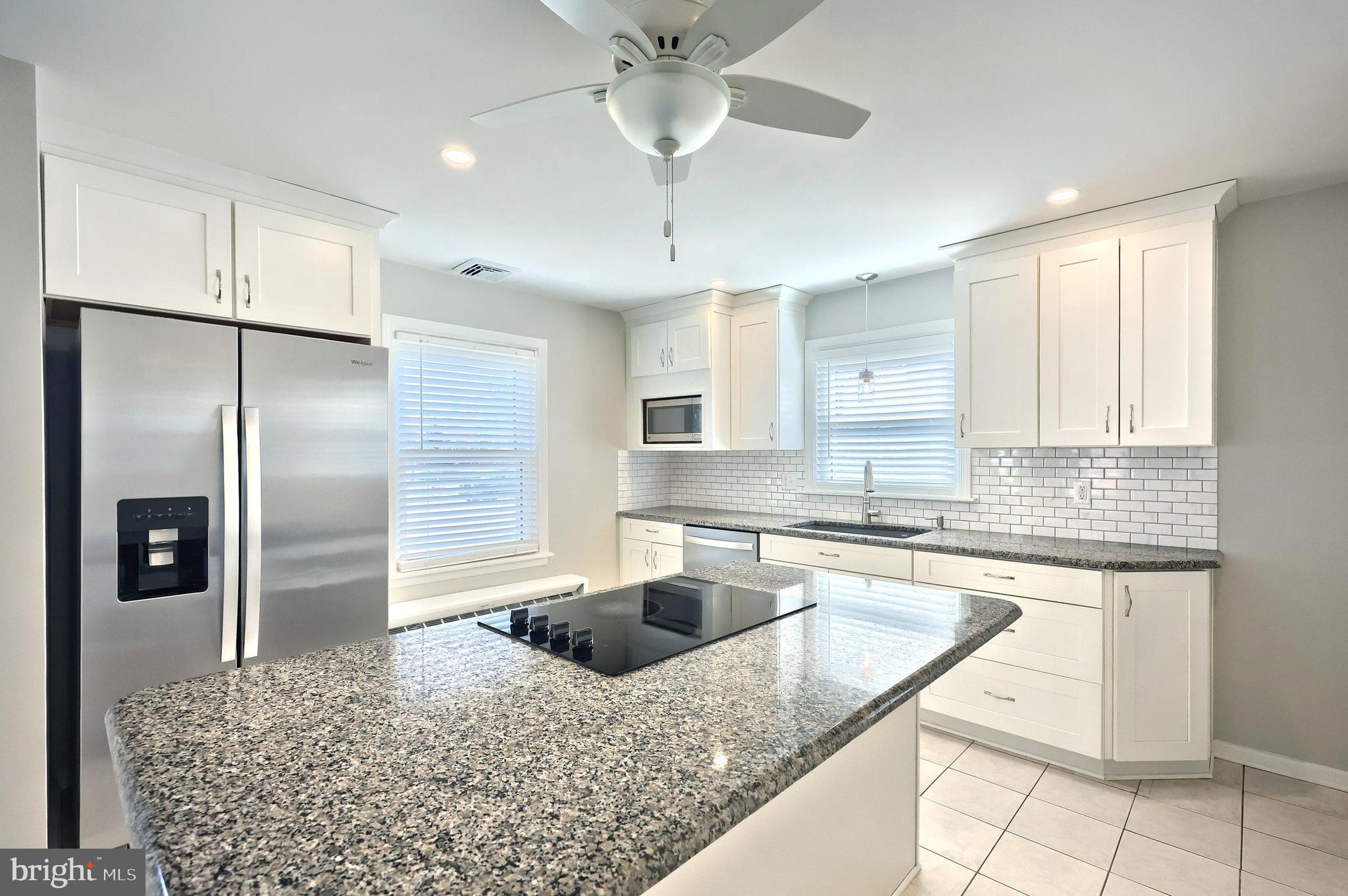 106 North Williams Street York, PA 17404 - Photo 18 of 42 a kitchen with stainless steel appliances granite countertop a sink a refrigerator and a stove