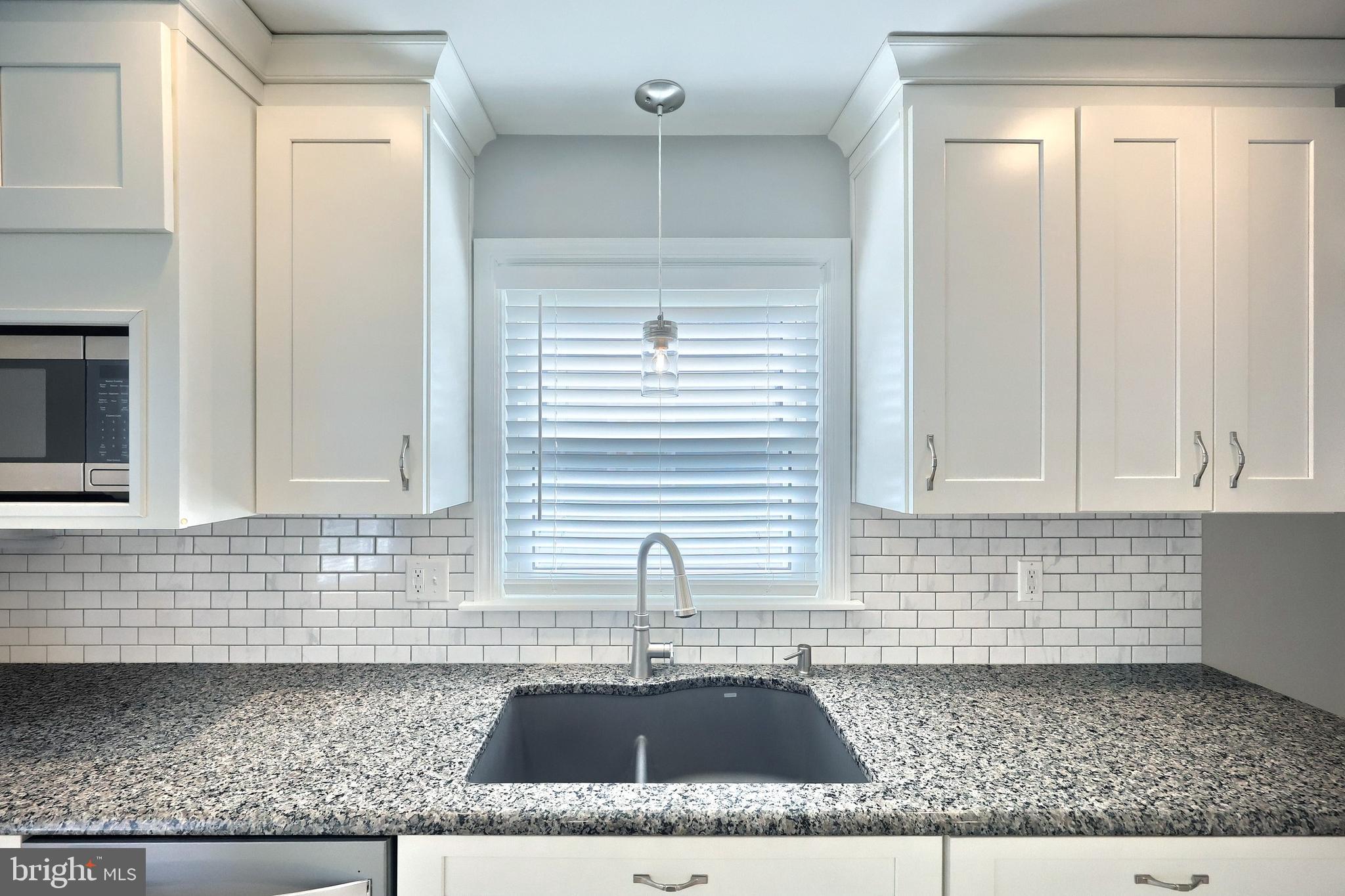 106 North Williams Street York, PA 17404 - Photo 19 of 42 a kitchen with a sink cabinets and window