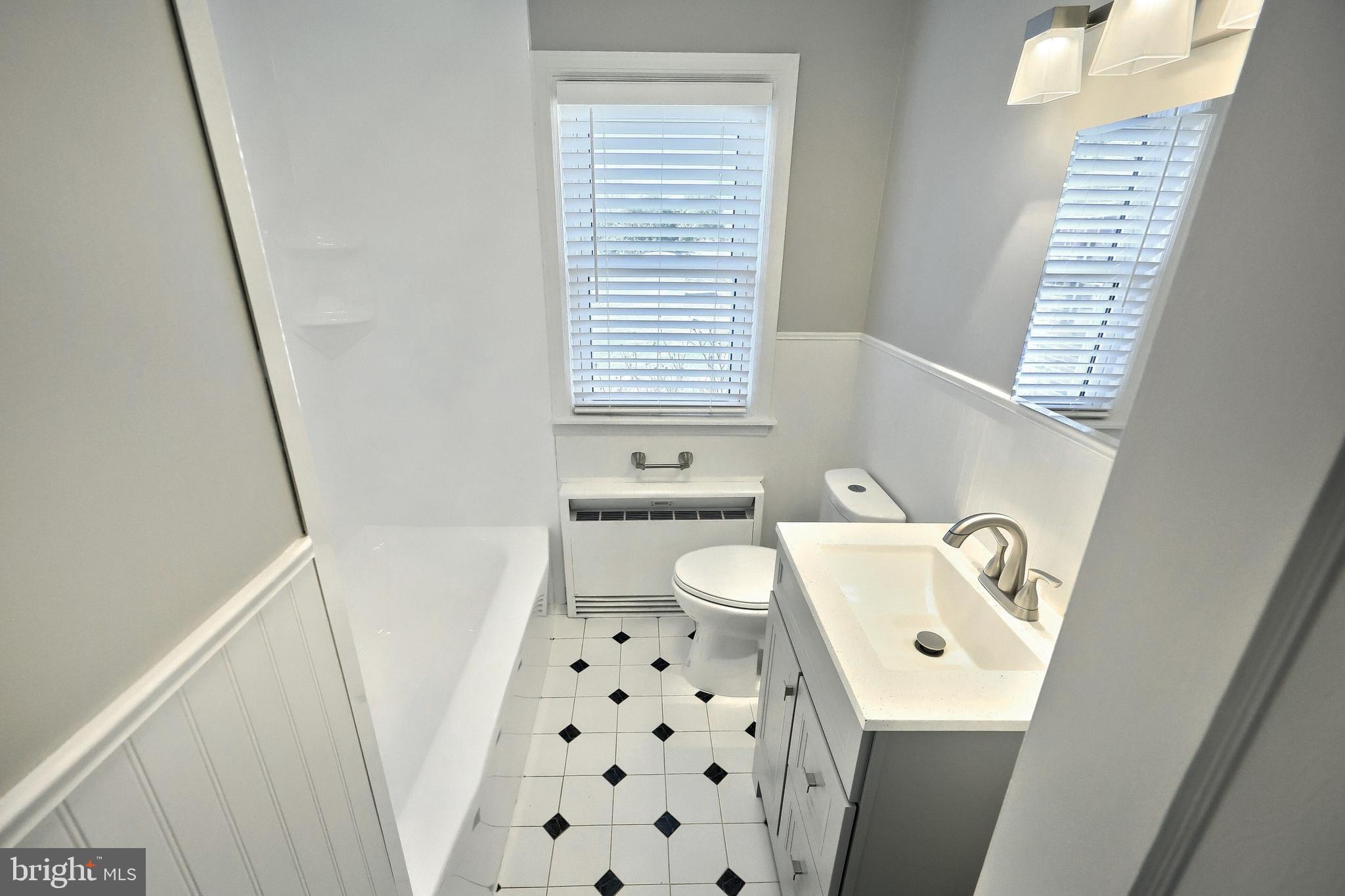 106 North Williams Street York, PA 17404 - Photo 23 of 42 a bathroom with a sink a toilet and a window