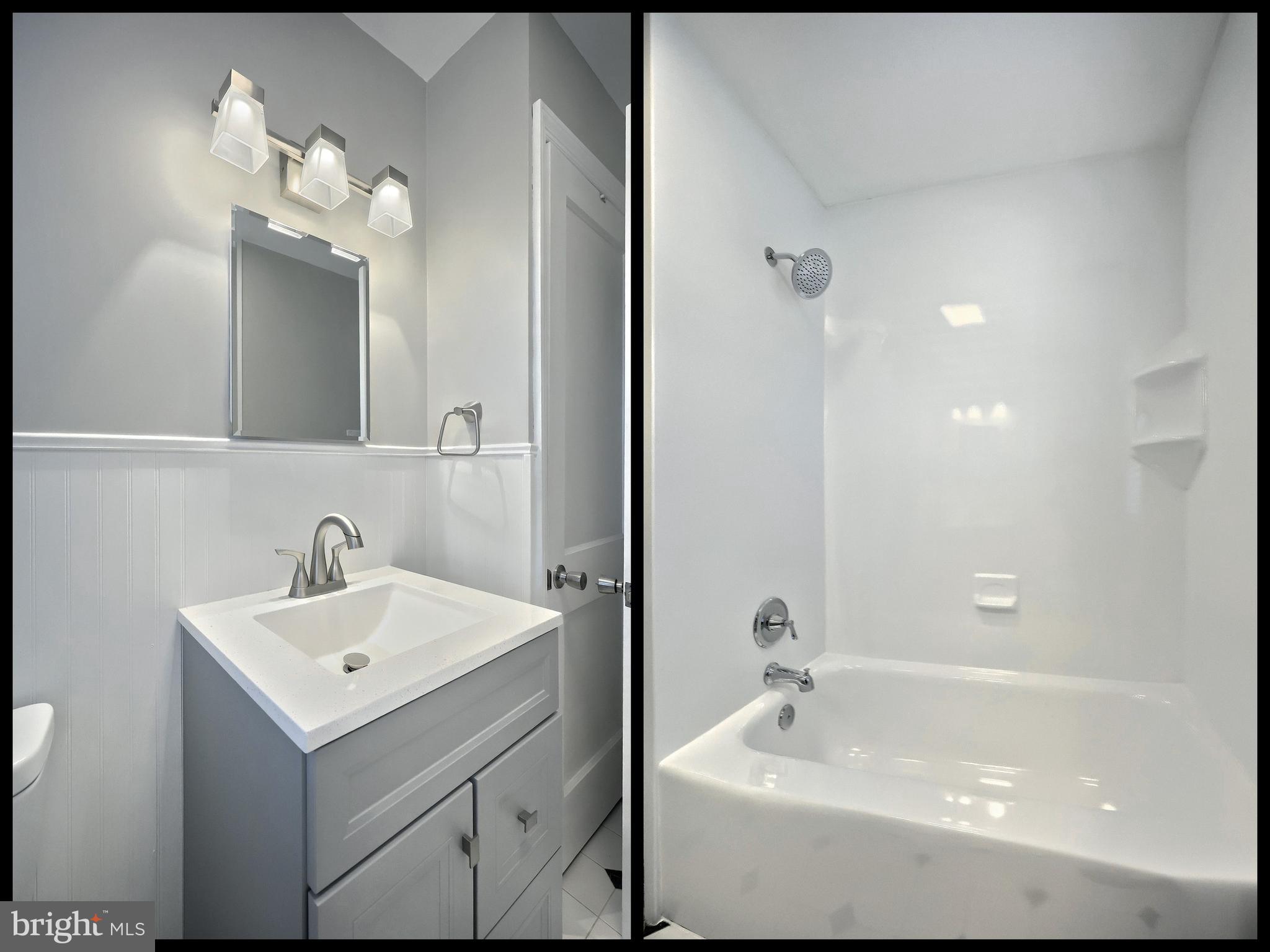 106 North Williams Street York, PA 17404 - Photo 24 of 42 a bathroom with a sink a mirror and a shower