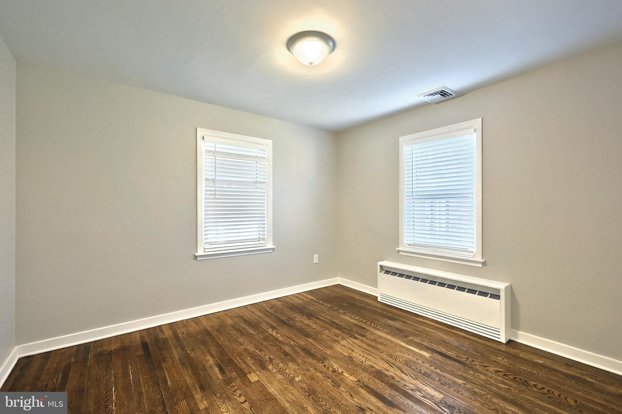 106 North Williams Street York, PA 17404 - Photo 25 of 42 a view of a room with wooden floor and staircase