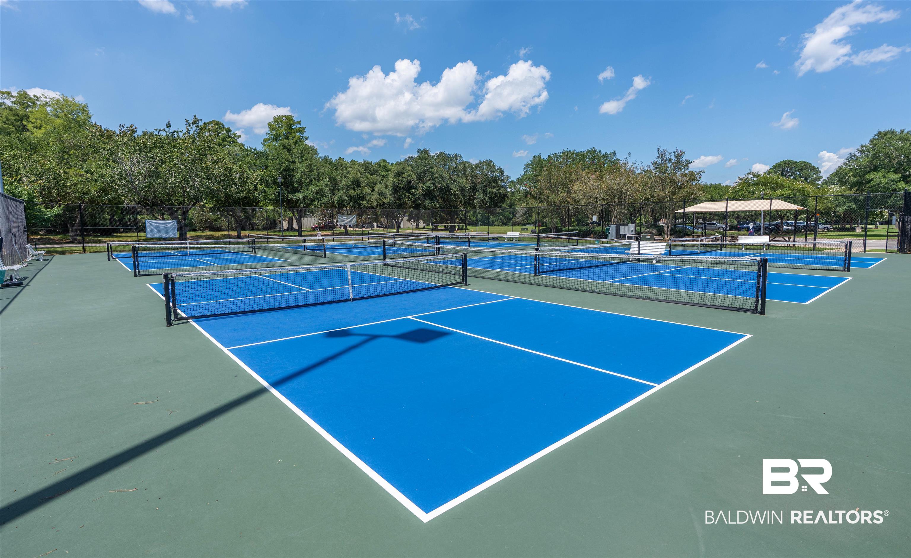 19741 Hunters Loop Fairhope, AL 36532 - Photo 38 of 42 View of tennis court with view of wooded area