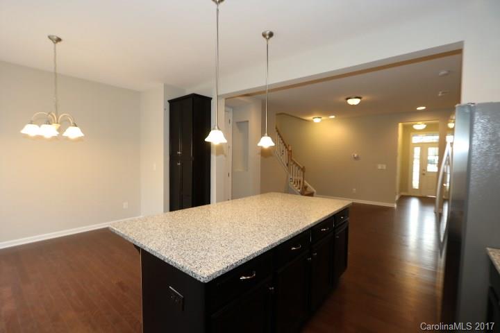 1108 Roderick Drive Fort Mill, SC 29708 - Photo 4 of 19 a kitchen with a sink a counter space and a chandelier