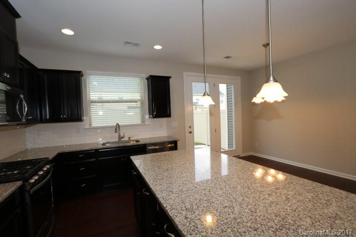 1108 Roderick Drive Fort Mill, SC 29708 - Photo 5 of 19 a kitchen with stainless steel appliances granite countertop sink stove and refrigerator