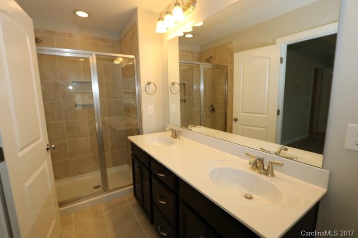 1108 Roderick Drive Fort Mill, SC 29708 - Photo 8 of 19 a bathroom with a sink shower and a mirror