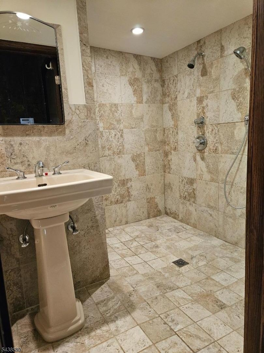 218 Devon Road Essex Fells, NJ 07021 - Photo 23 of 24 a bathroom with a sink a toilet and a mirror