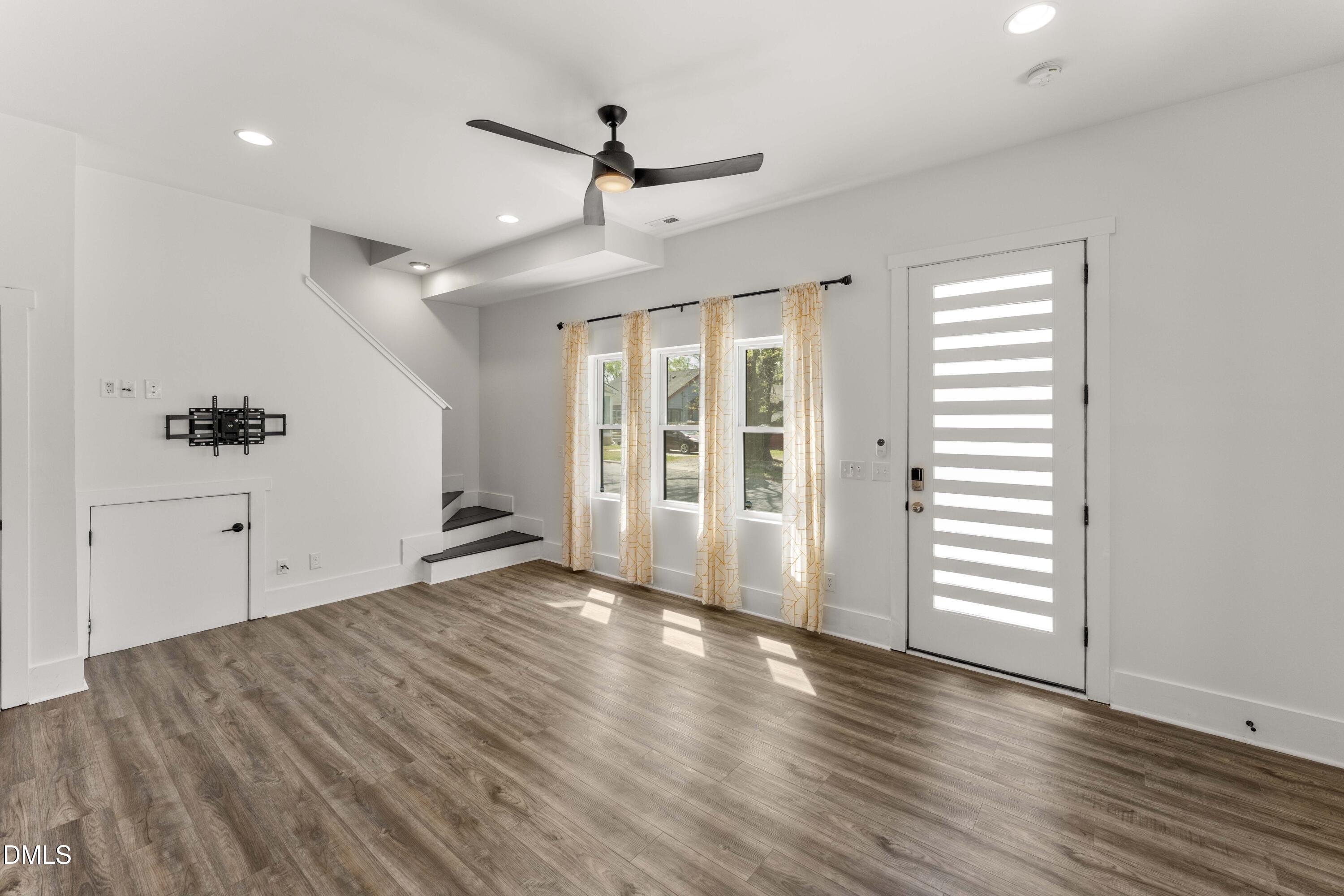 203 Nelson Street Durham, NC 27707 - Photo 12 of 29 wooden floor in an empty room with a window