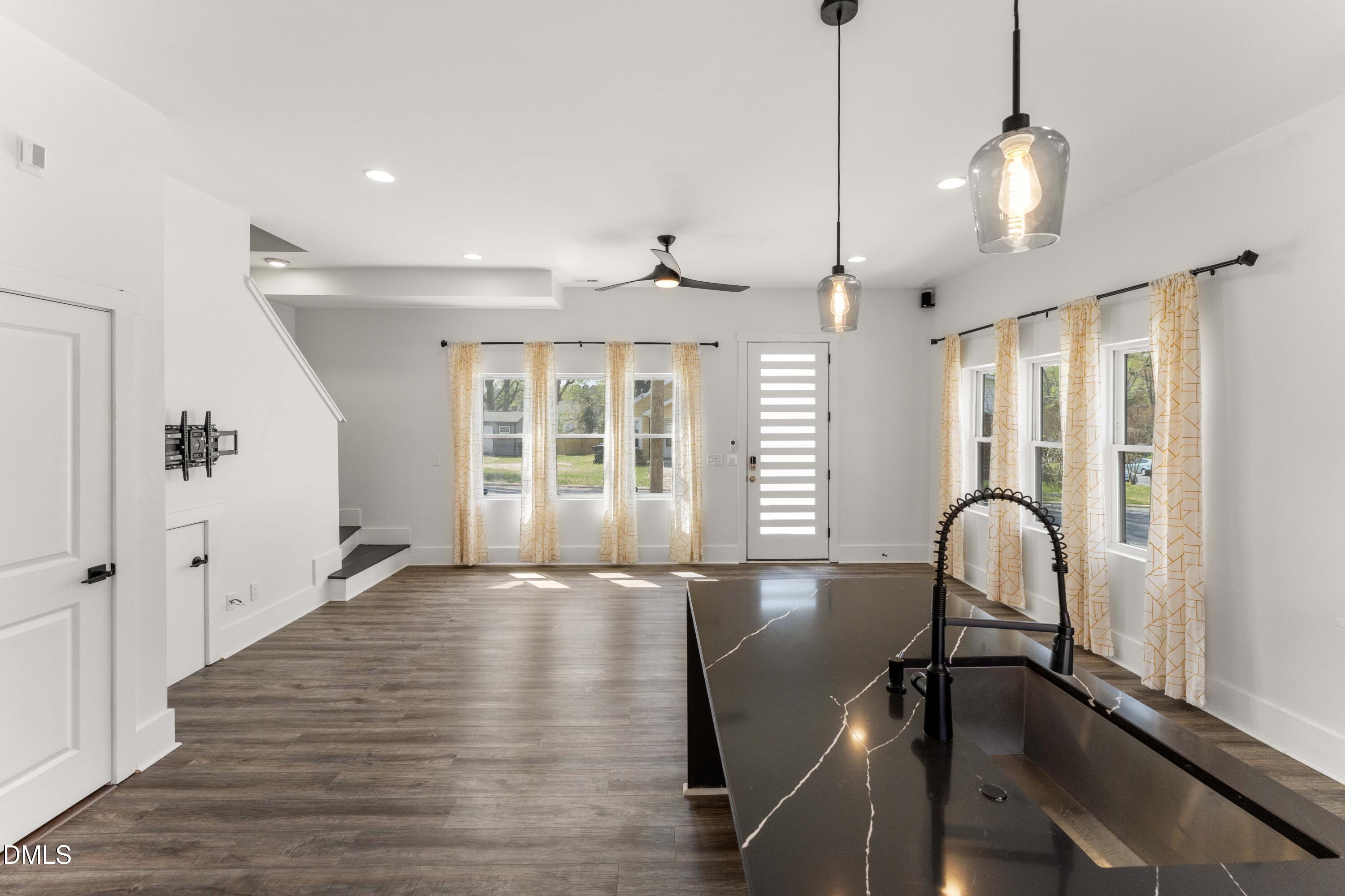203 Nelson Street Durham, NC 27707 - Photo 13 of 29 a view of a room with wooden floor and windows