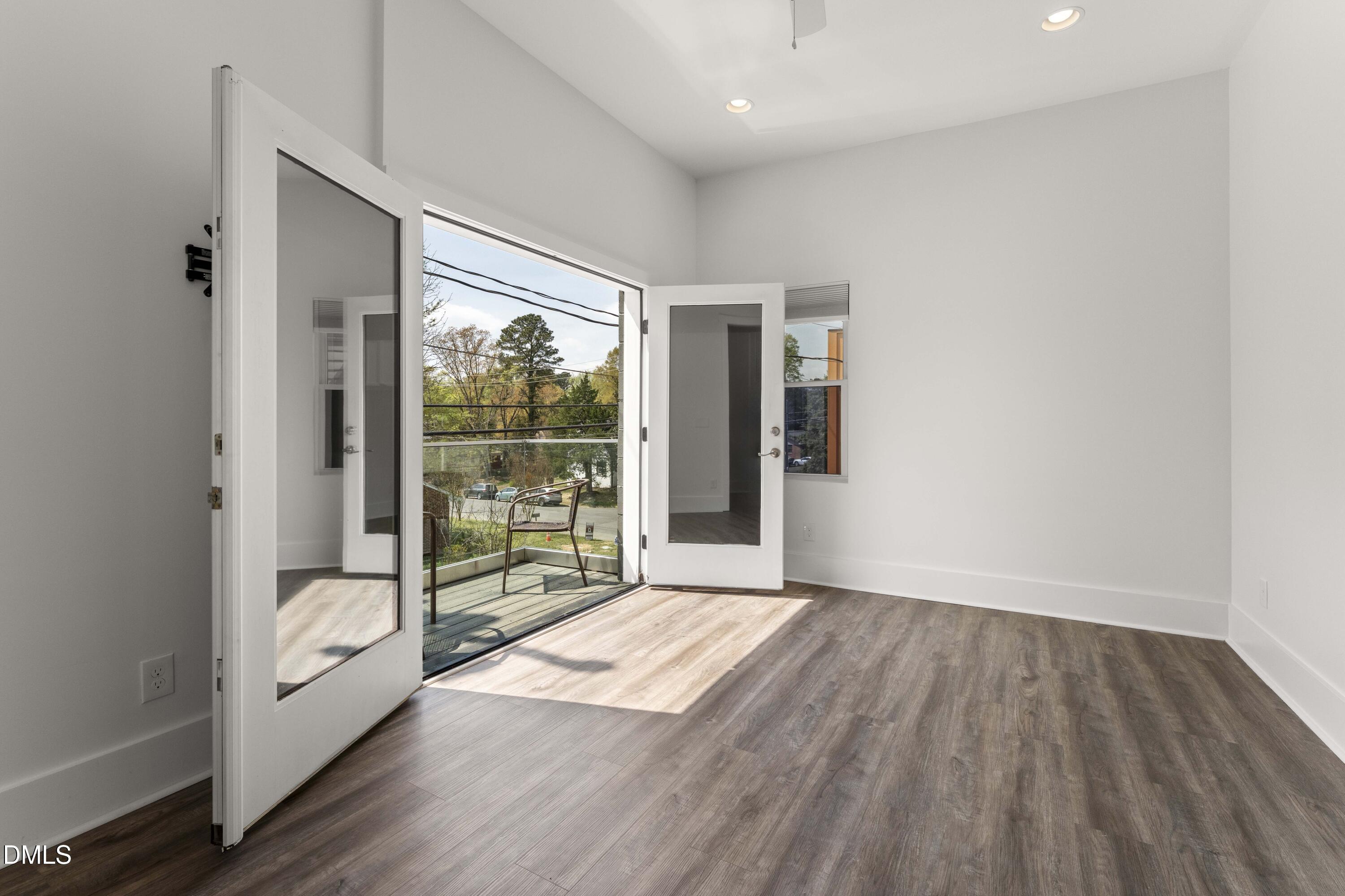 203 Nelson Street Durham, NC 27707 - Photo 15 of 29 a view of livingroom with furniture and wooden floor