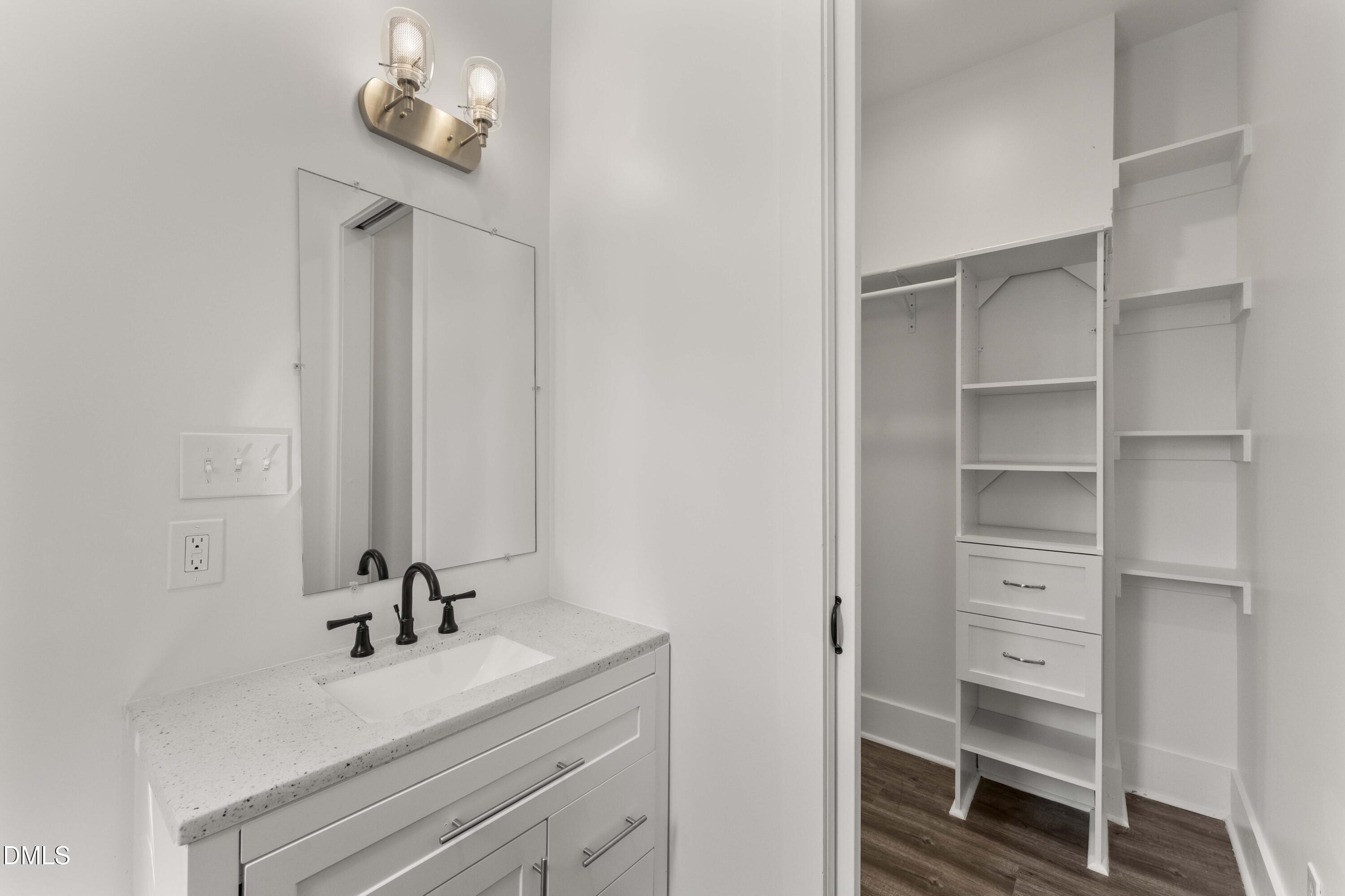 203 Nelson Street Durham, NC 27707 - Photo 20 of 29 a bathroom with a sink a toilet and a mirror