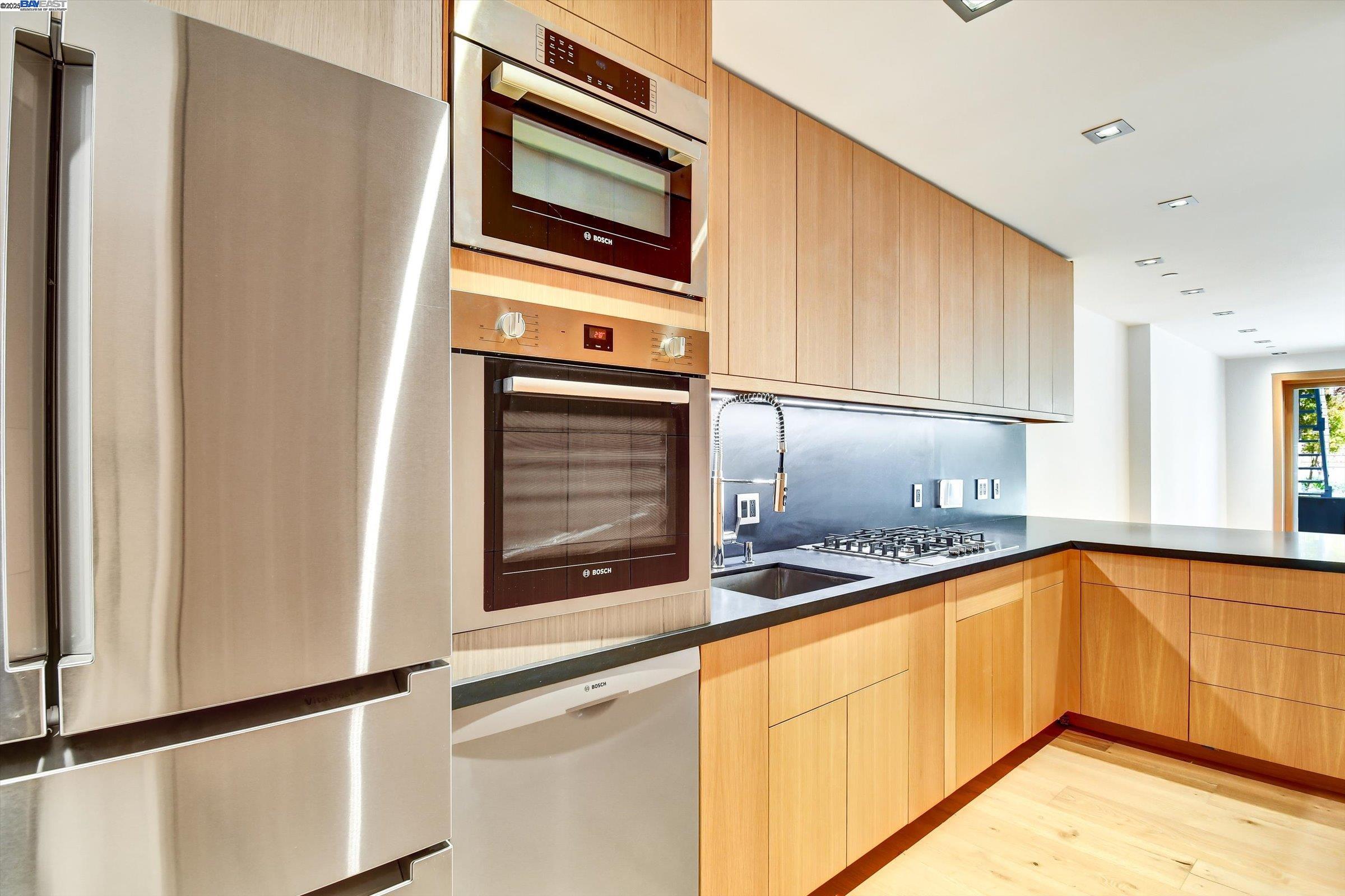 1208 Stanyan Street San Francisco, CA 94117 - Photo 11 of 60 a kitchen with granite countertop cabinets stainless steel appliances and sink