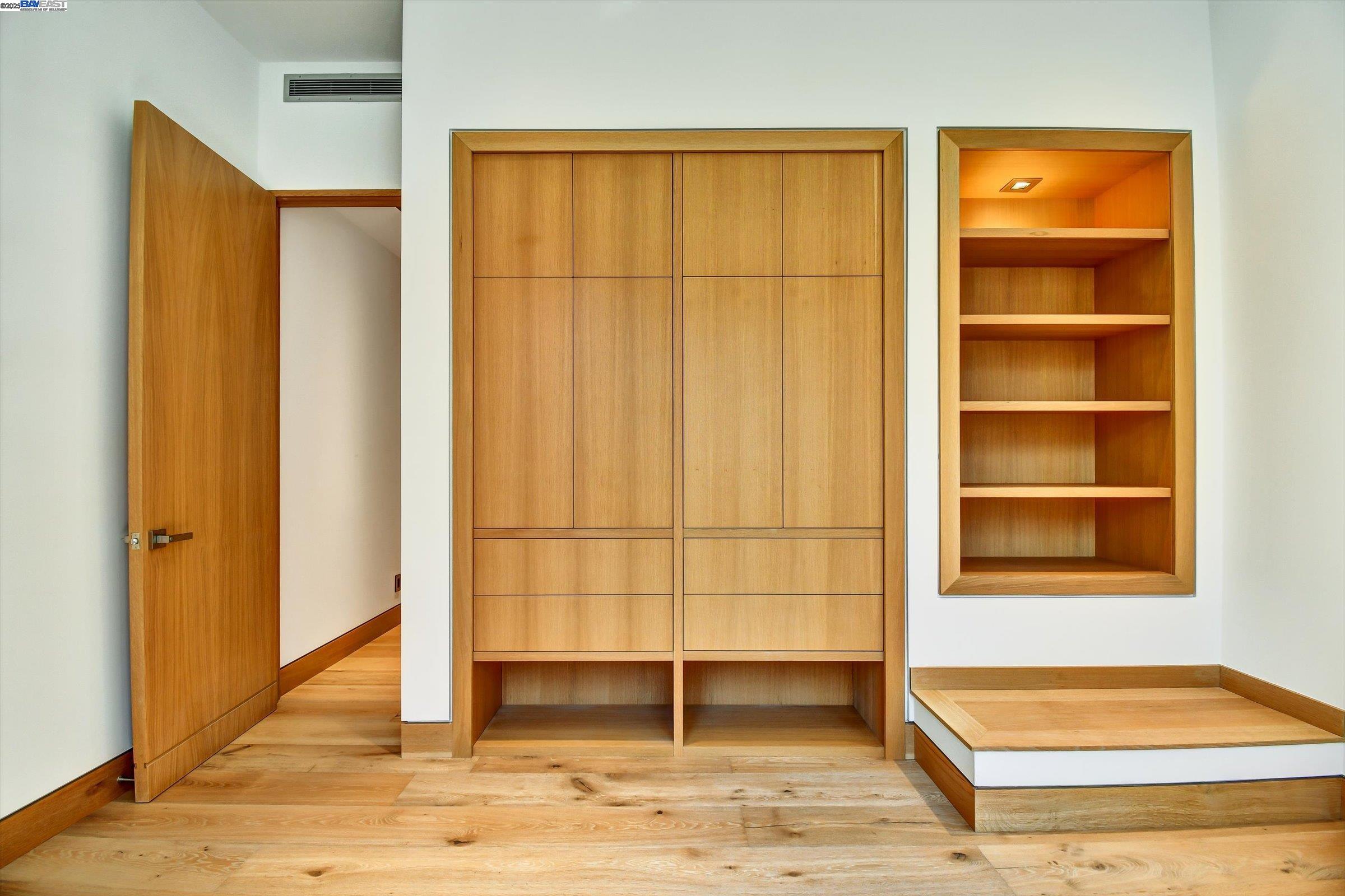 1208 Stanyan Street San Francisco, CA 94117 - Photo 20 of 60 a view of a bedroom with wooden floor and windows
