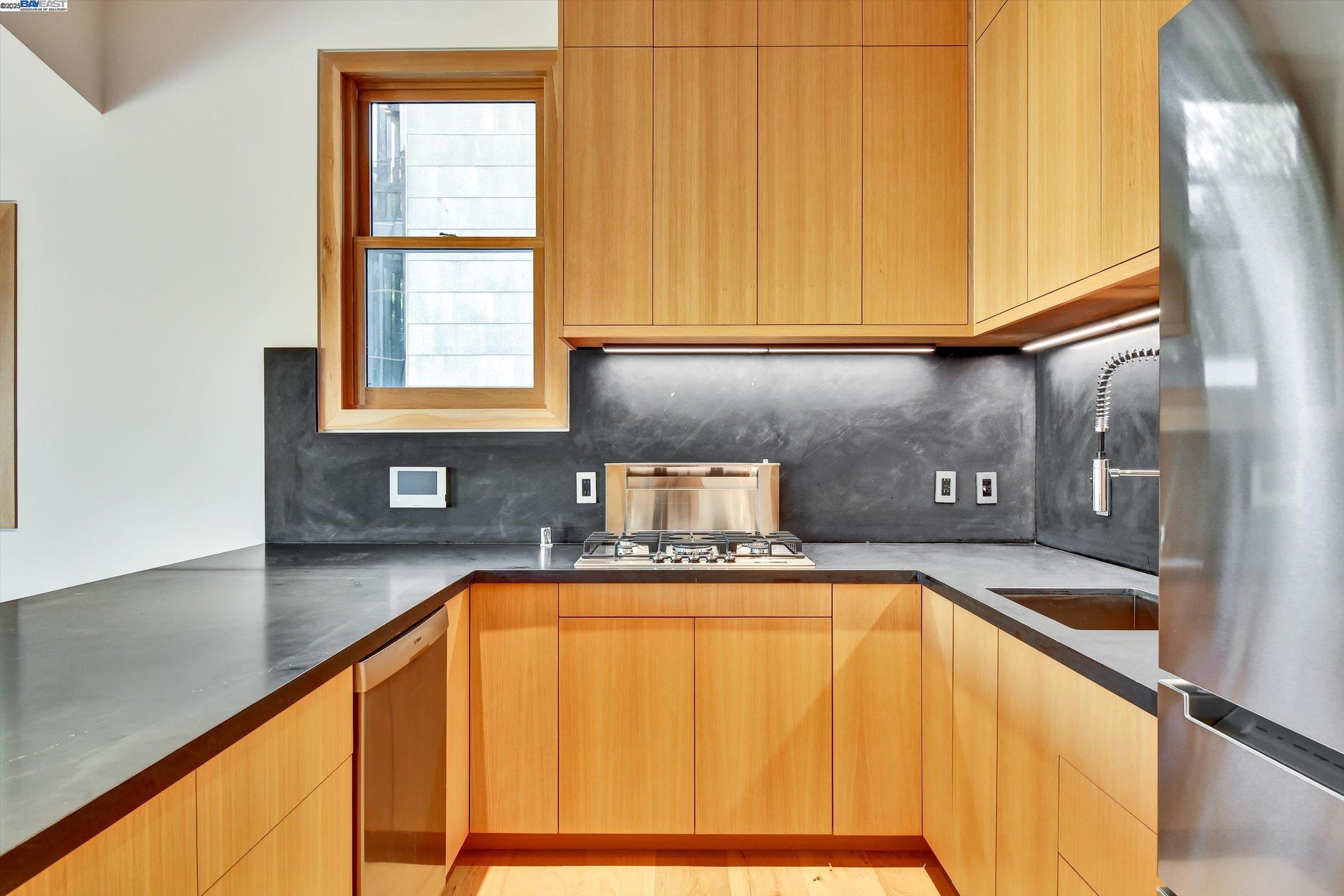 1208 Stanyan Street San Francisco, CA 94117 - Photo 29 of 60 a view of a kitchen with granite countertop a sink and cabinets