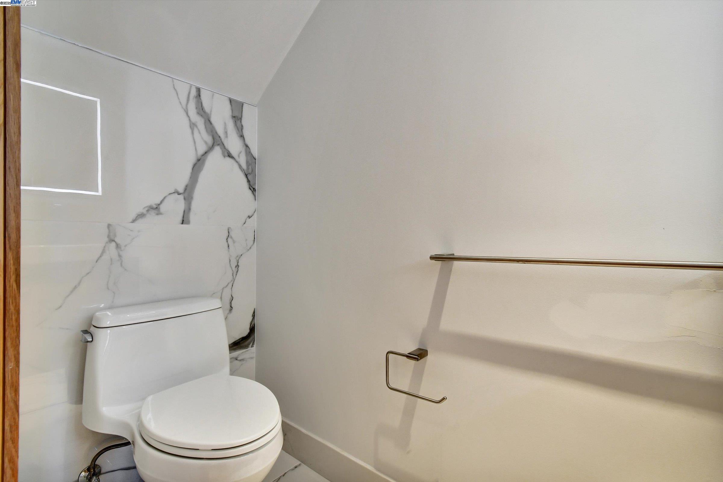 1208 Stanyan Street San Francisco, CA 94117 - Photo 30 of 60 a white toilet sitting next to a shower