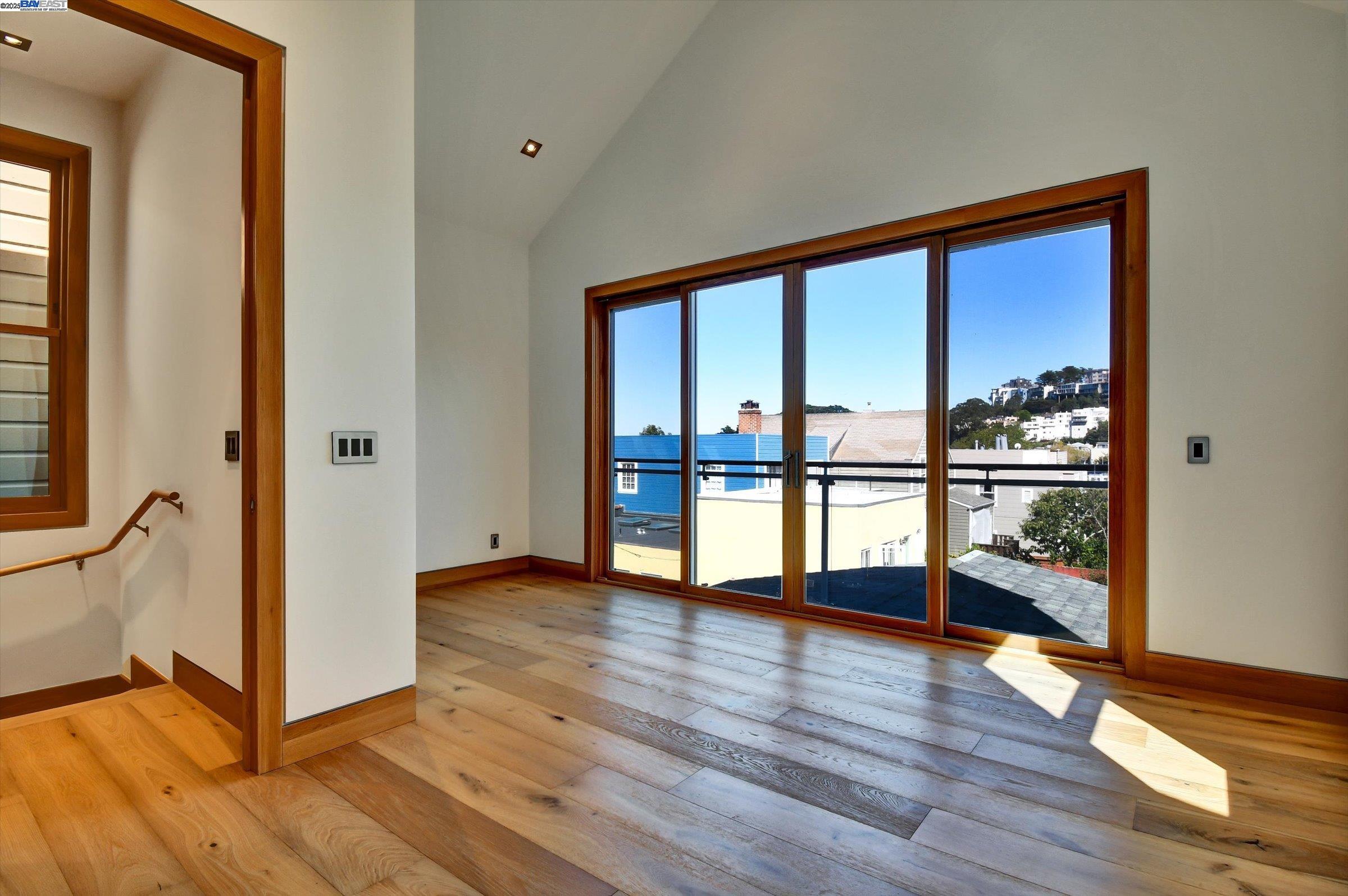 1208 Stanyan Street San Francisco, CA 94117 - Photo 32 of 60 a view of a big room with wooden floor and windows