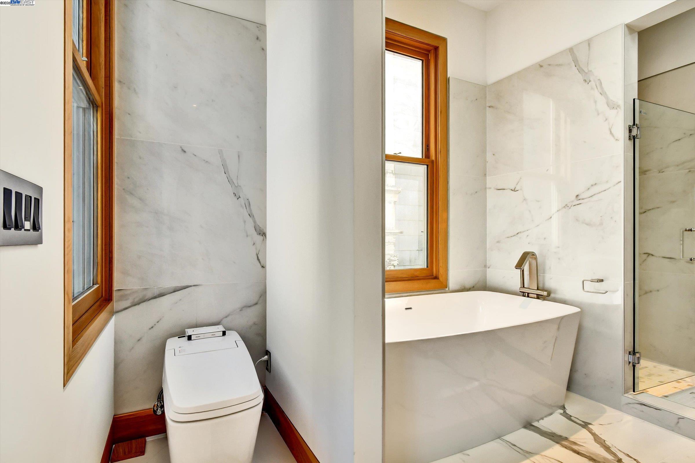 1208 Stanyan Street San Francisco, CA 94117 - Photo 36 of 60 a bathroom with a granite countertop sink a toilet and shower