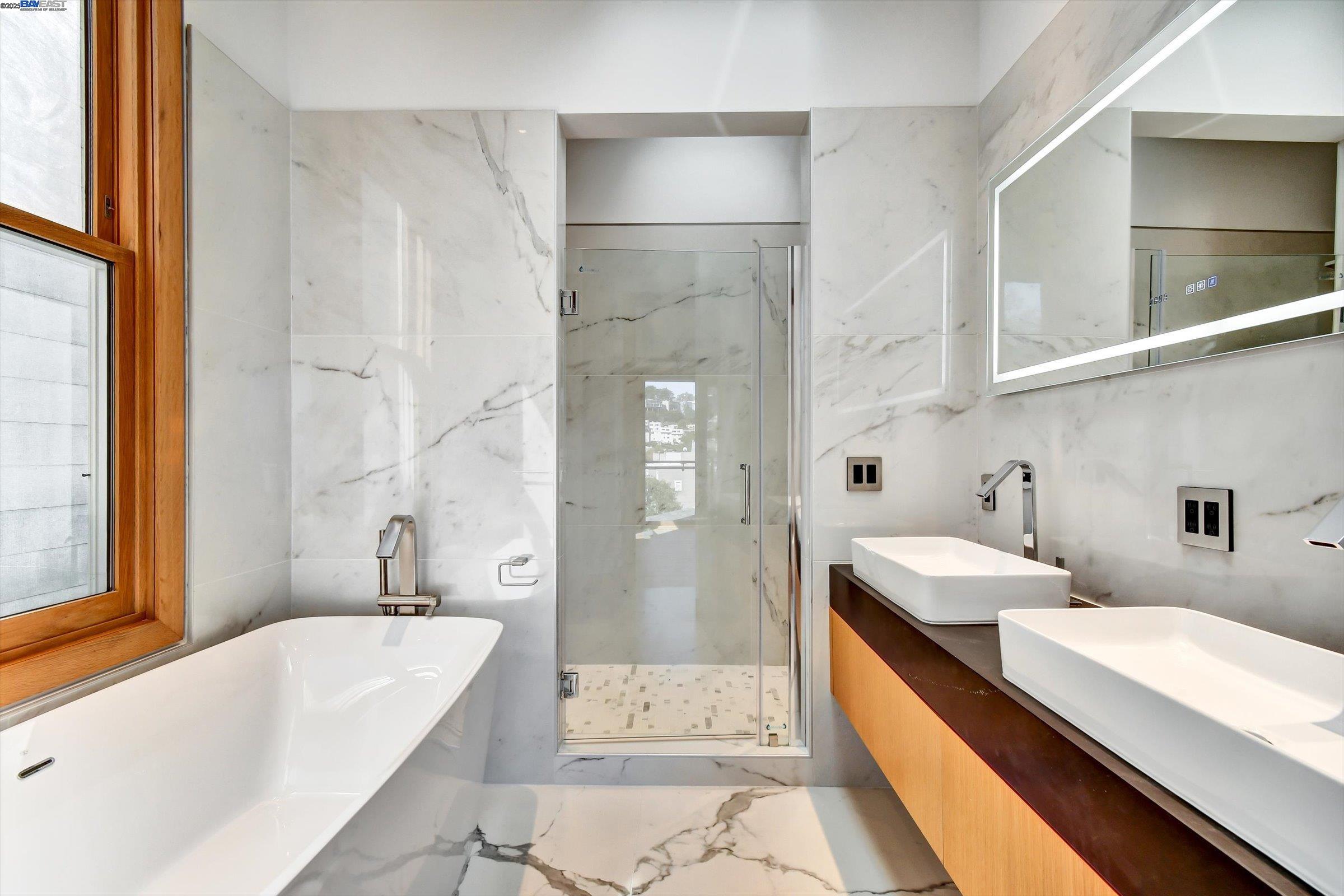 1208 Stanyan Street San Francisco, CA 94117 - Photo 37 of 60 a bathroom with a granite countertop tub sink and mirror