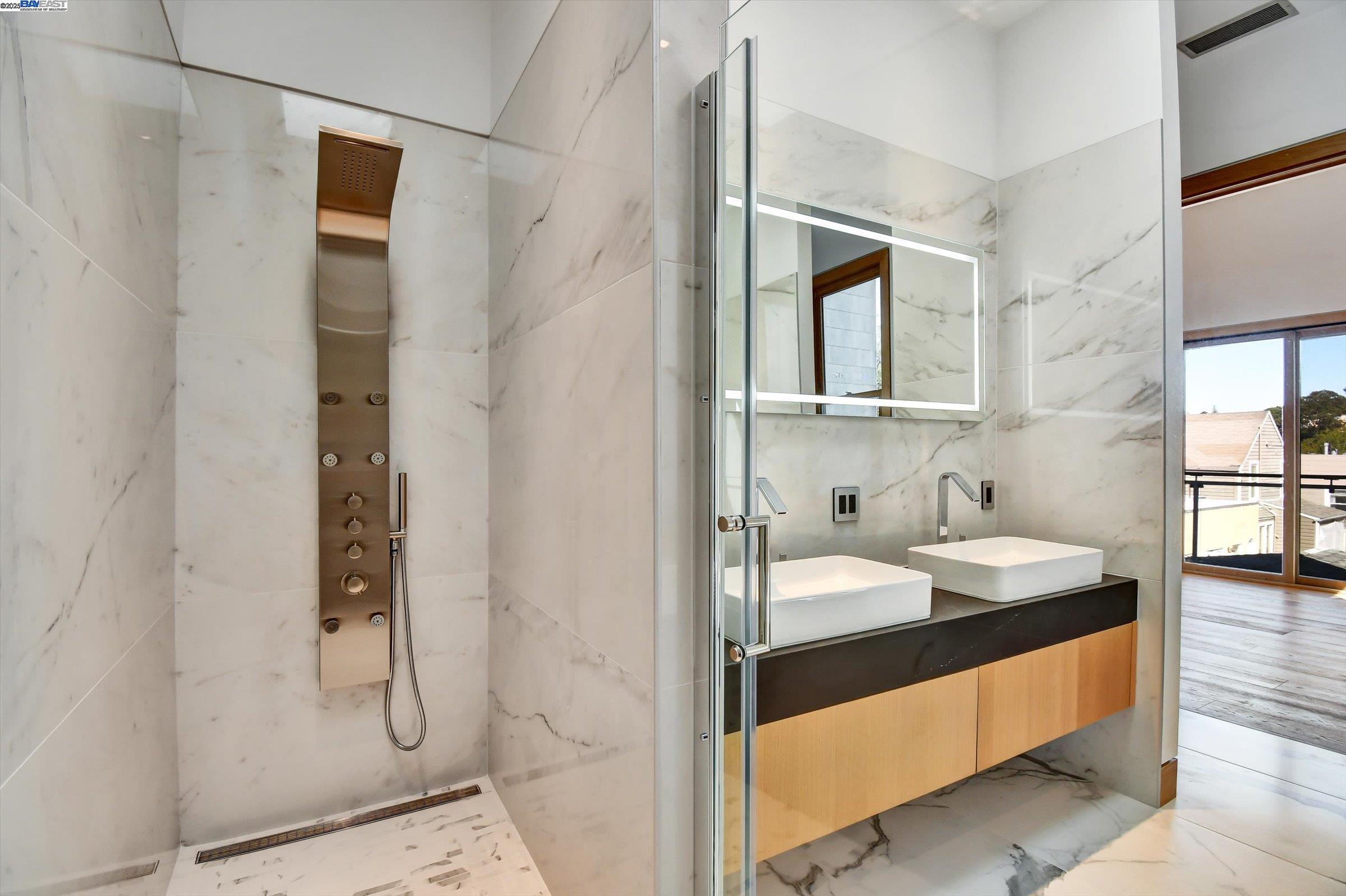 1208 Stanyan Street San Francisco, CA 94117 - Photo 38 of 60 a en suite bathroom with a sink and a mirror