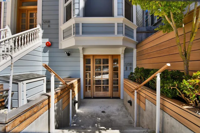 a view of an empty room with glass door