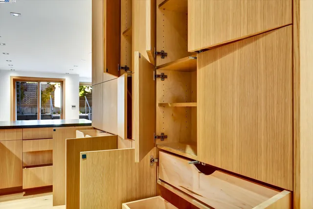 an aerial view of a house with a yard basket ball court and outdoor seating