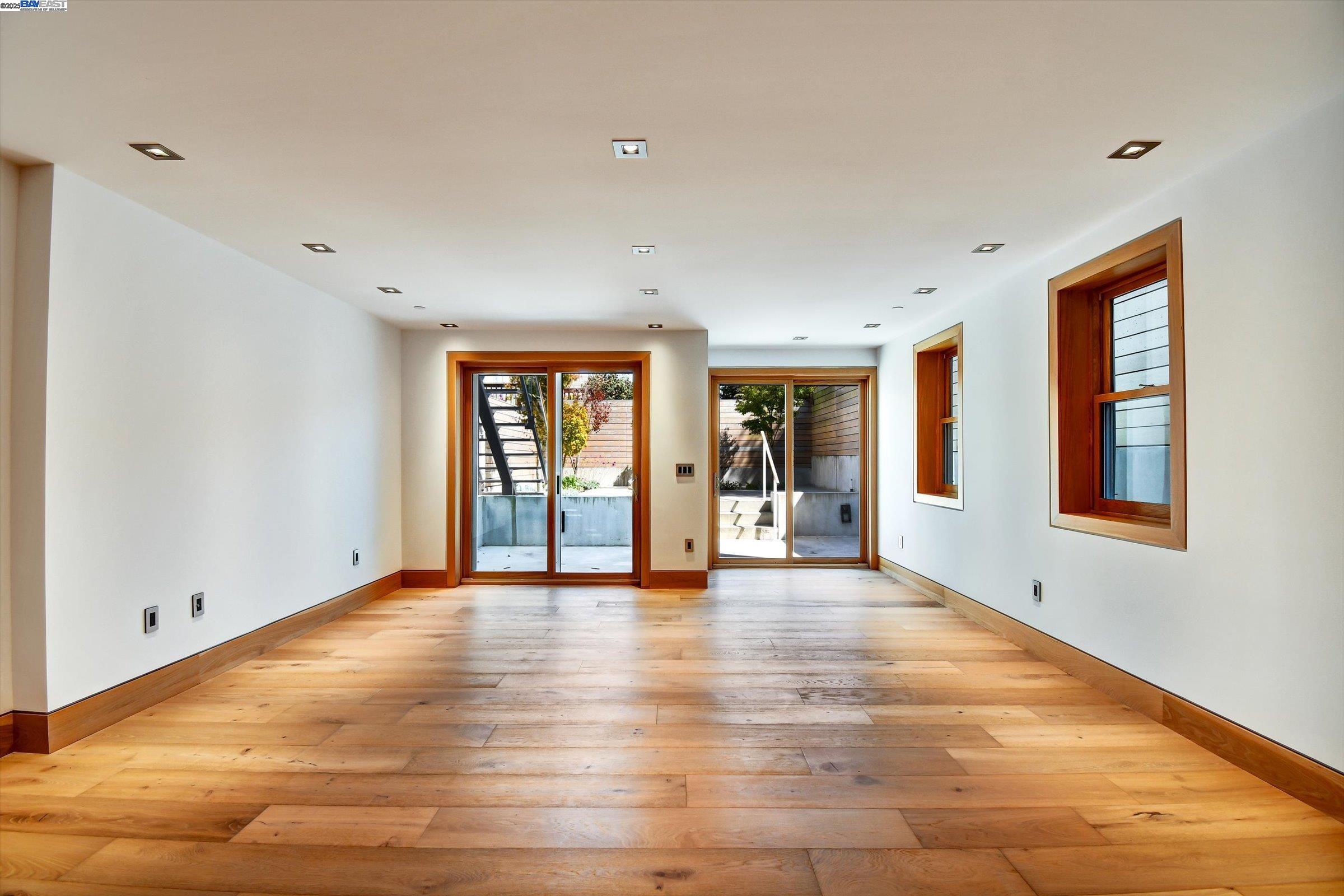 1208 Stanyan Street San Francisco, CA 94117 - Photo 8 of 60 a view of an empty room with window and wooden floor