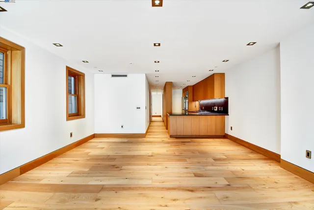 a view of a hallway with stairs