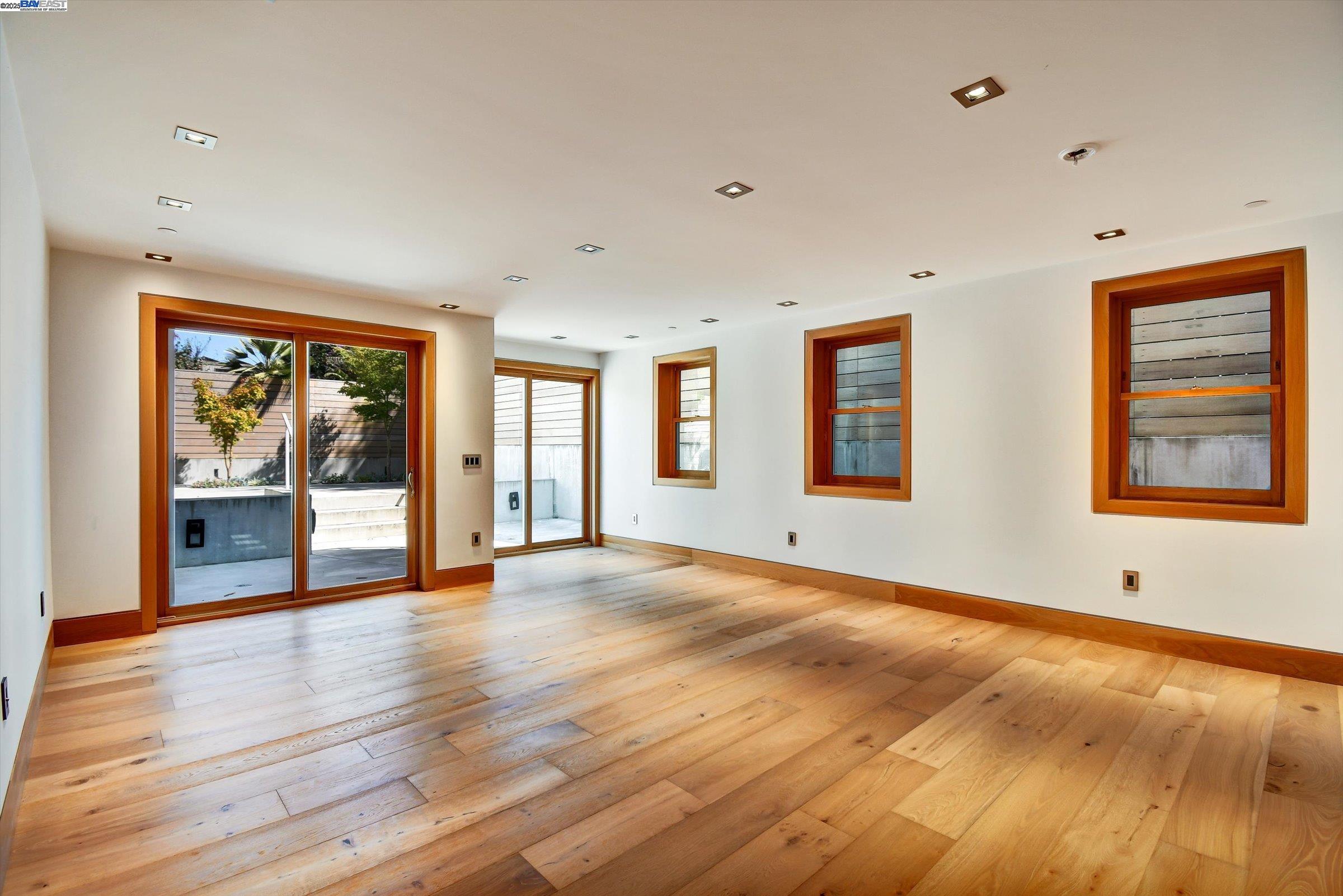 1208 Stanyan Street San Francisco, CA 94117 - Photo 10 of 60 a view of an empty room with window and wooden floor