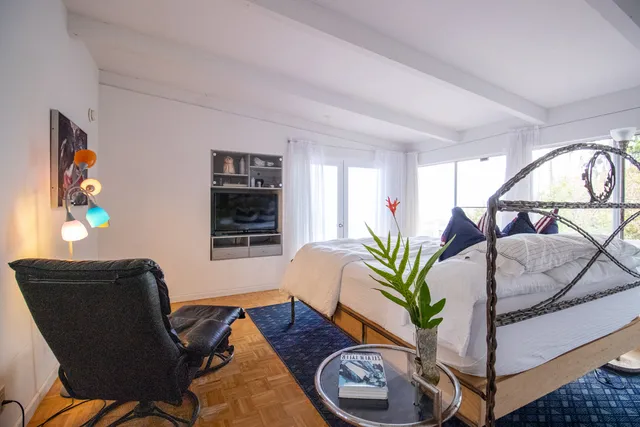 a vase of flowers sitting on a table in a living room