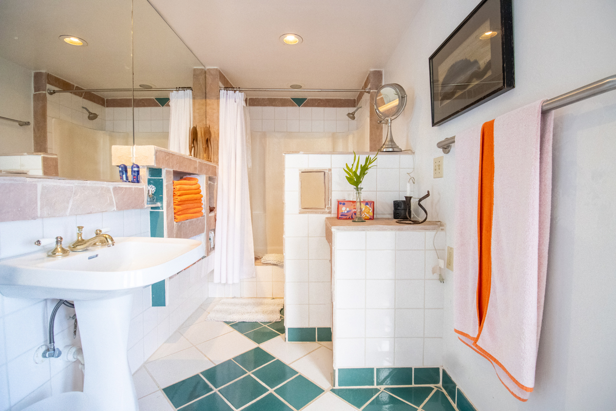 84-5063 Hawaii Belt Road Captain Cook, HI 96704 - Photo 15 of 30 a bathroom with a sink a mirror and a shower