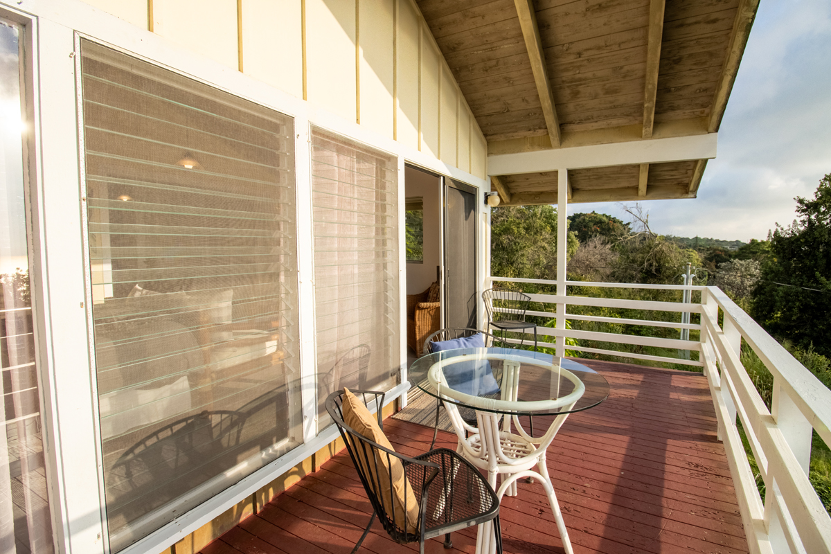 84-5063 Hawaii Belt Road Captain Cook, HI 96704 - Photo 23 of 30 a view of a balcony with table and chairs