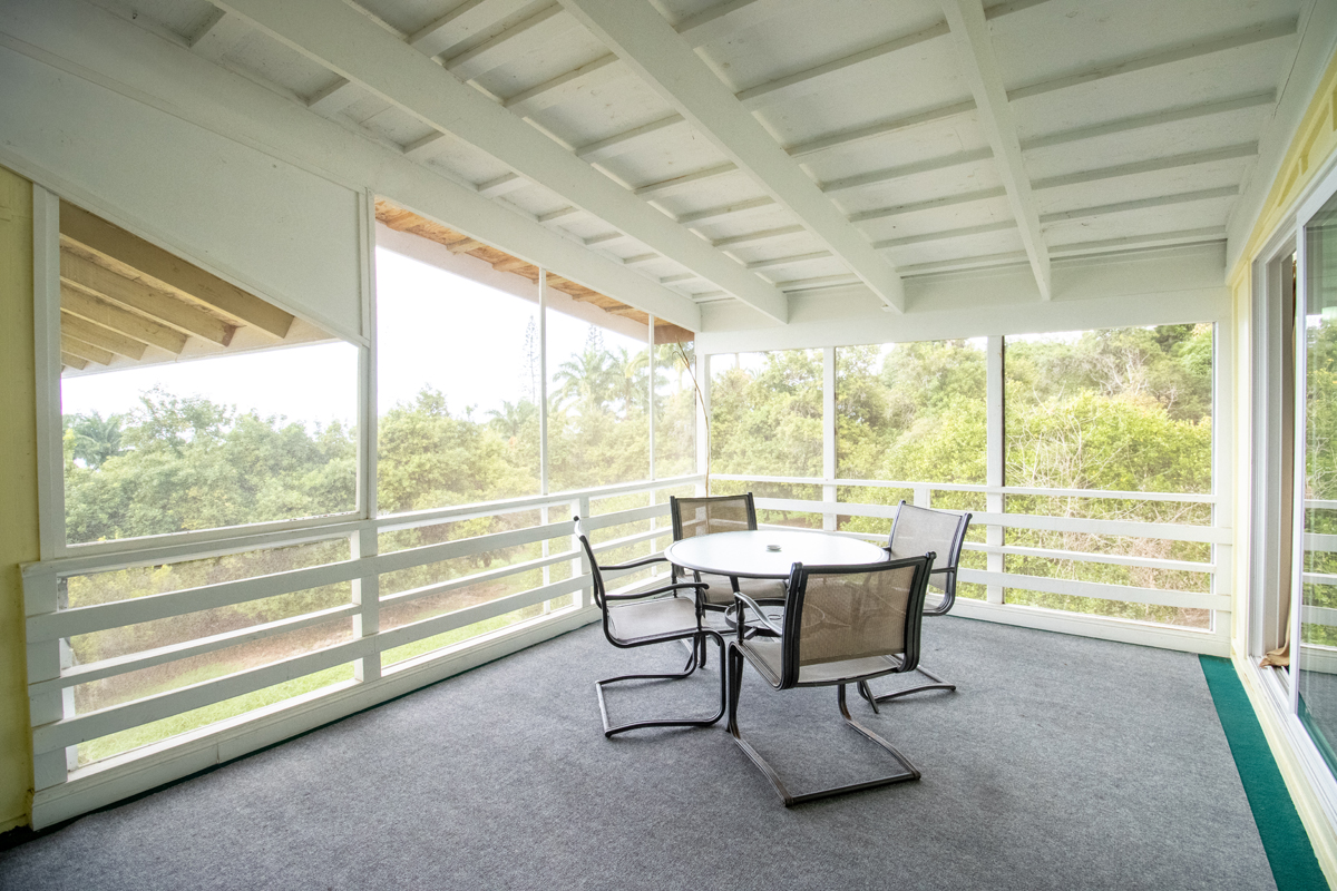 84-5063 Hawaii Belt Road Captain Cook, HI 96704 - Photo 29 of 30 a view of a room with a table and chairs