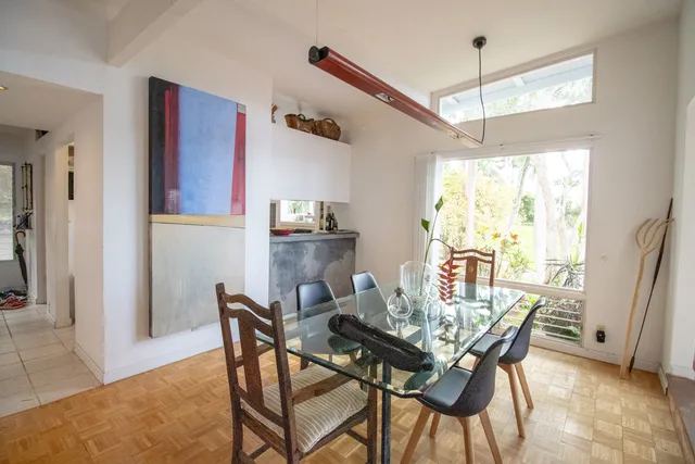 a view of a dining room with furniture window and outside view