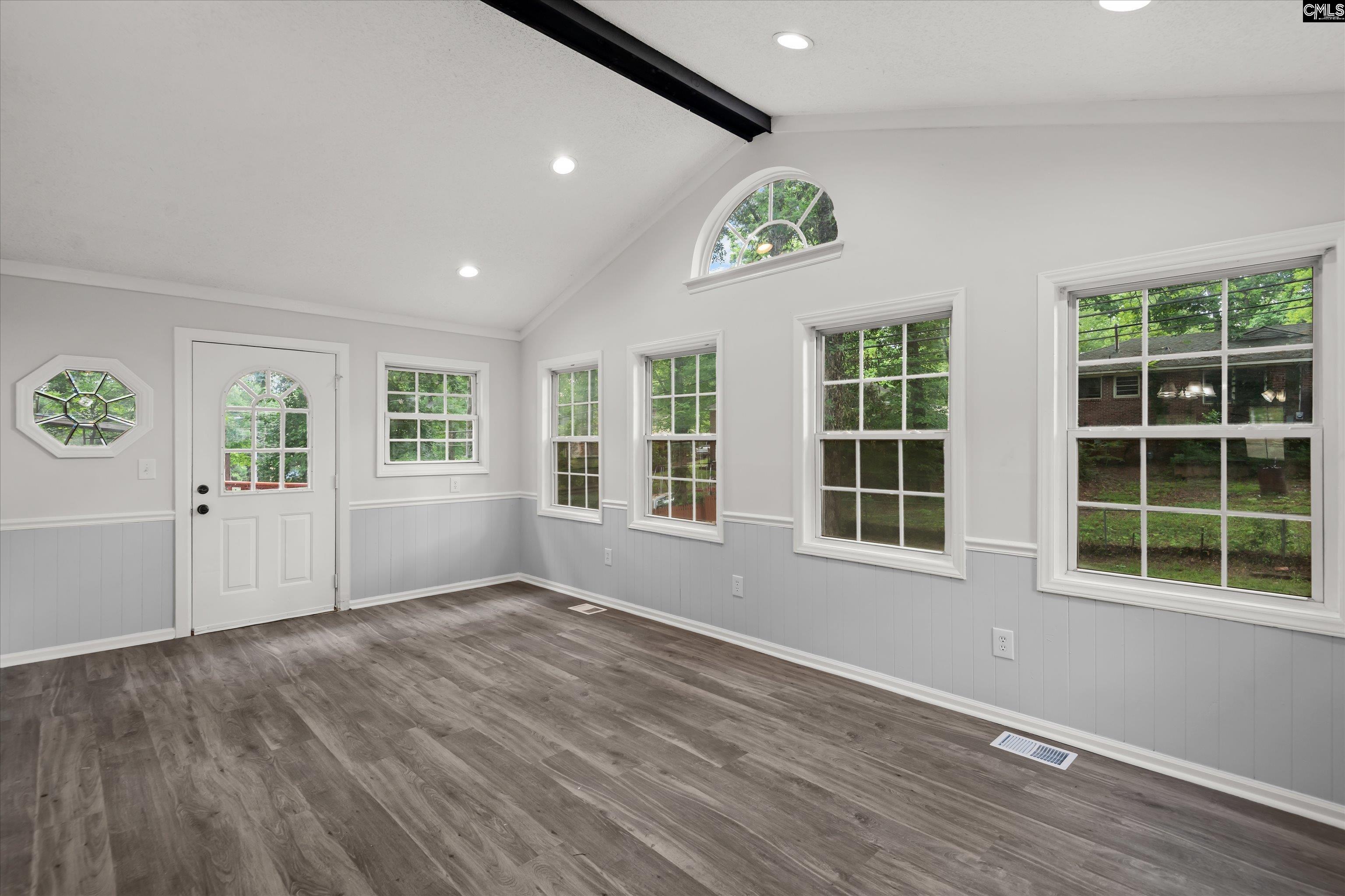 245 Piney Grove Road Columbia, SC 29210 - Photo 13 of 29 an empty room with wooden floor and windows