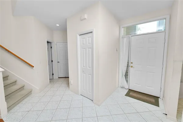 a view of a livingroom with an empty space and a hallway