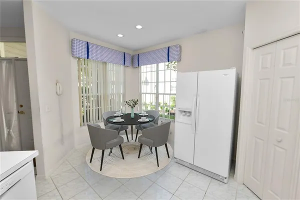 a dining room with furniture and window