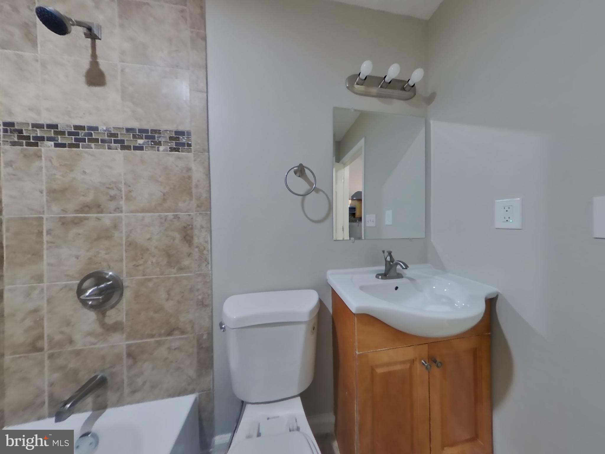 2000 Gaither Street Temple Hills, MD 20748 - Photo 13 of 21 a bathroom with a sink toilet and shower