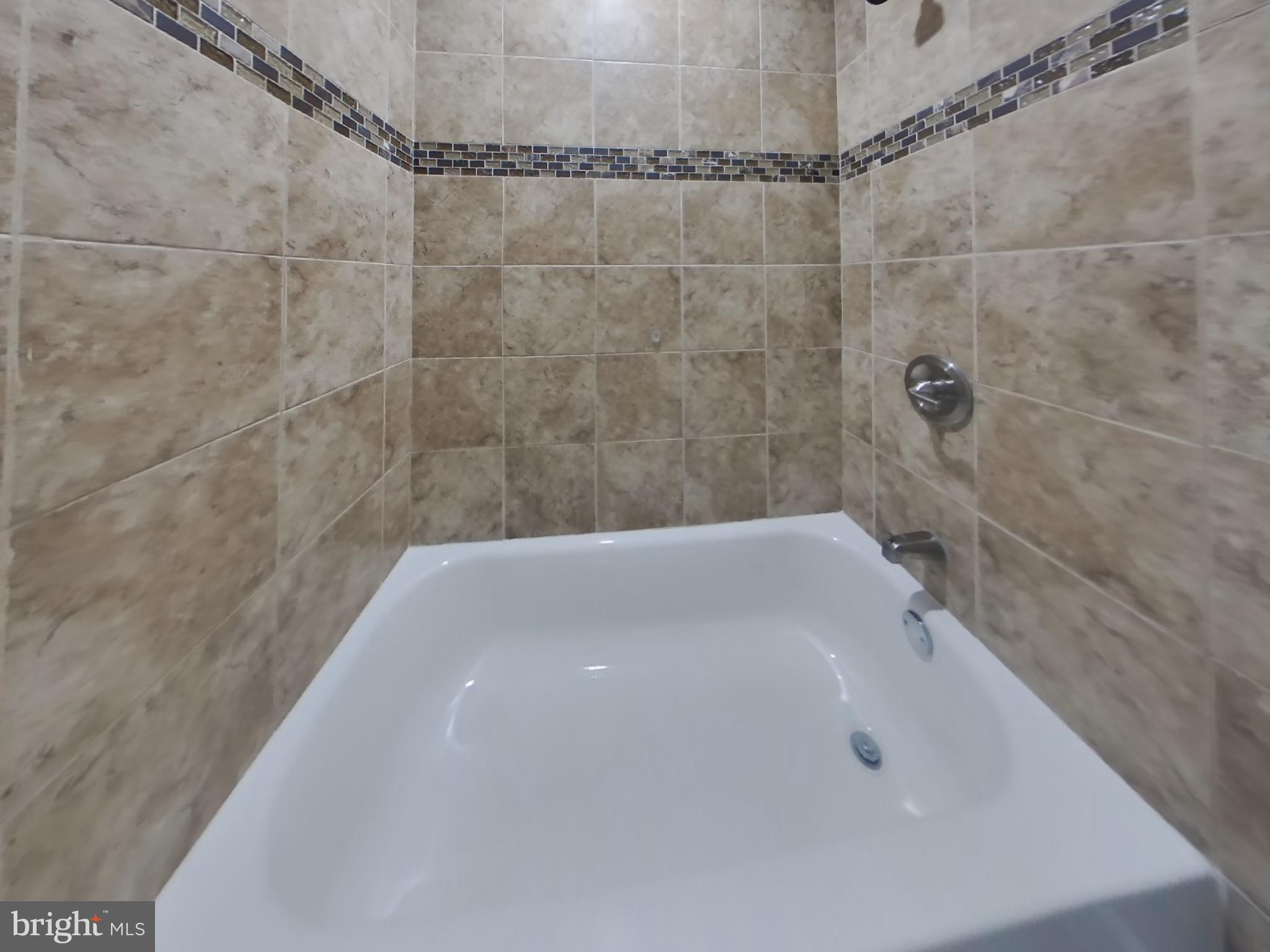 2000 Gaither Street Temple Hills, MD 20748 - Photo 14 of 21 a bathroom with a bathtub