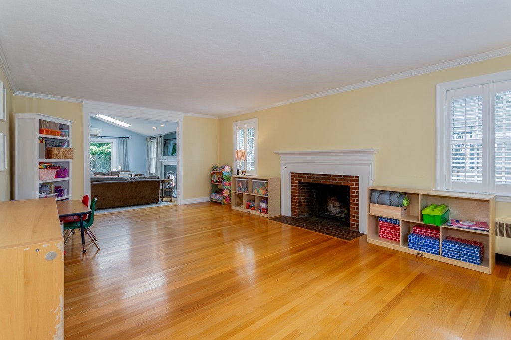 68 Chesterton Road Wellesley, MA 02481 - Photo 11 of 27 a living room with furniture and a fireplace