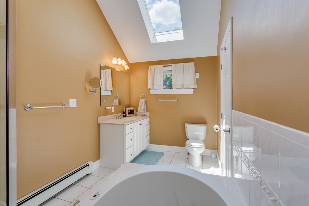 68 Chesterton Road Wellesley, MA 02481 - Photo 15 of 27 a bathroom with a sink a toilet and shower